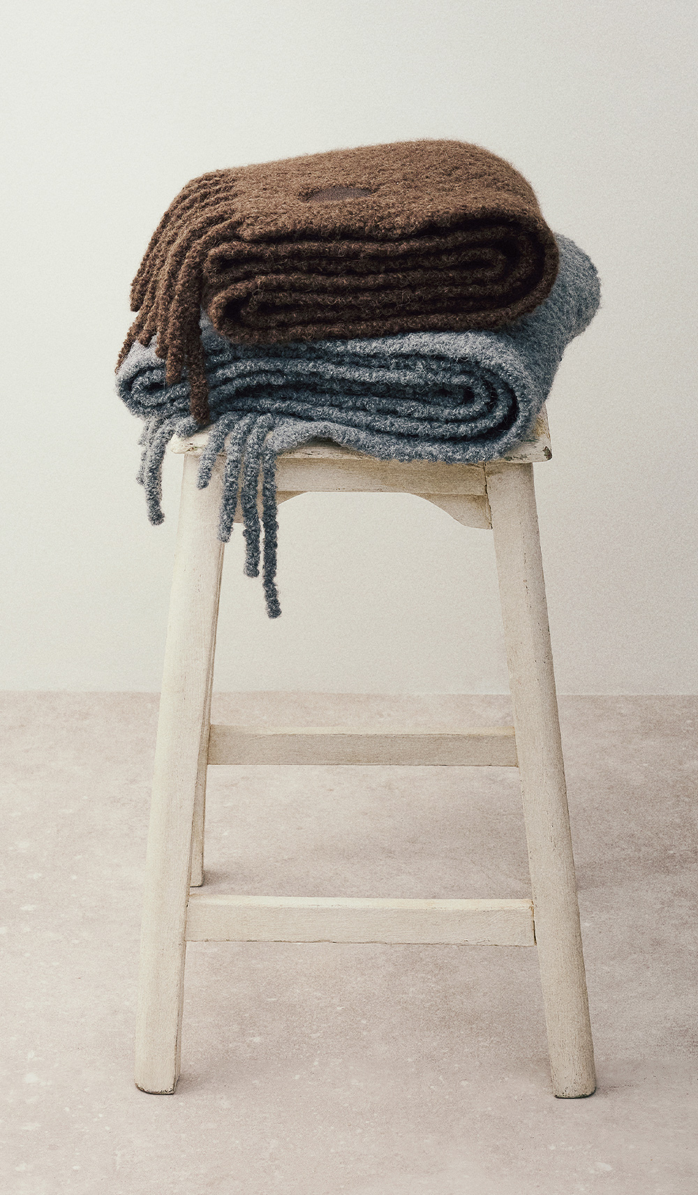 Two models of brown & blue scarves